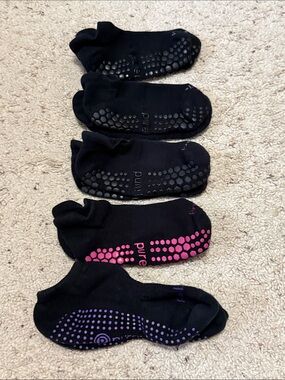 Pure Barre sticky socks. M/L. 3 black 1 purple 1 pink